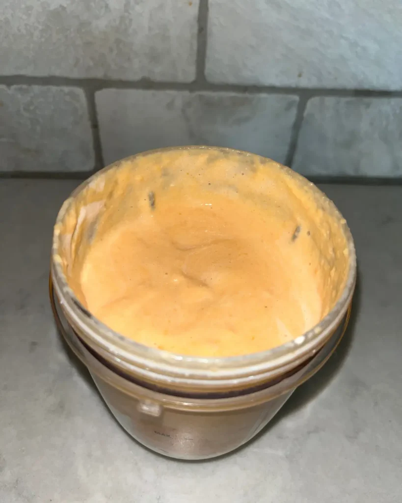 Cottage cheese and roasted sweet potatoes pureed in a blender cup.