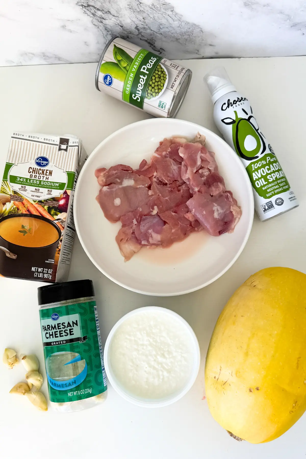The ingredients for the chicken alfredo spaghetti squash on a counter.
