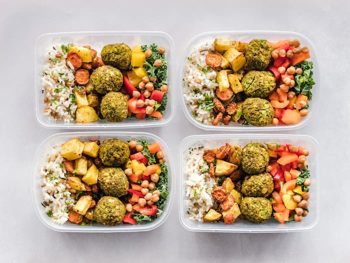 Individually portioned meals in storage containers for low calorie high protein meal prep.