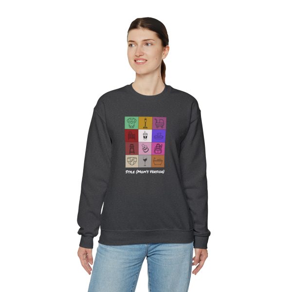 A woman wearing a sweatshirt with "Style" Mom's Version and a bunch of blocks depicting stages of motherhood.