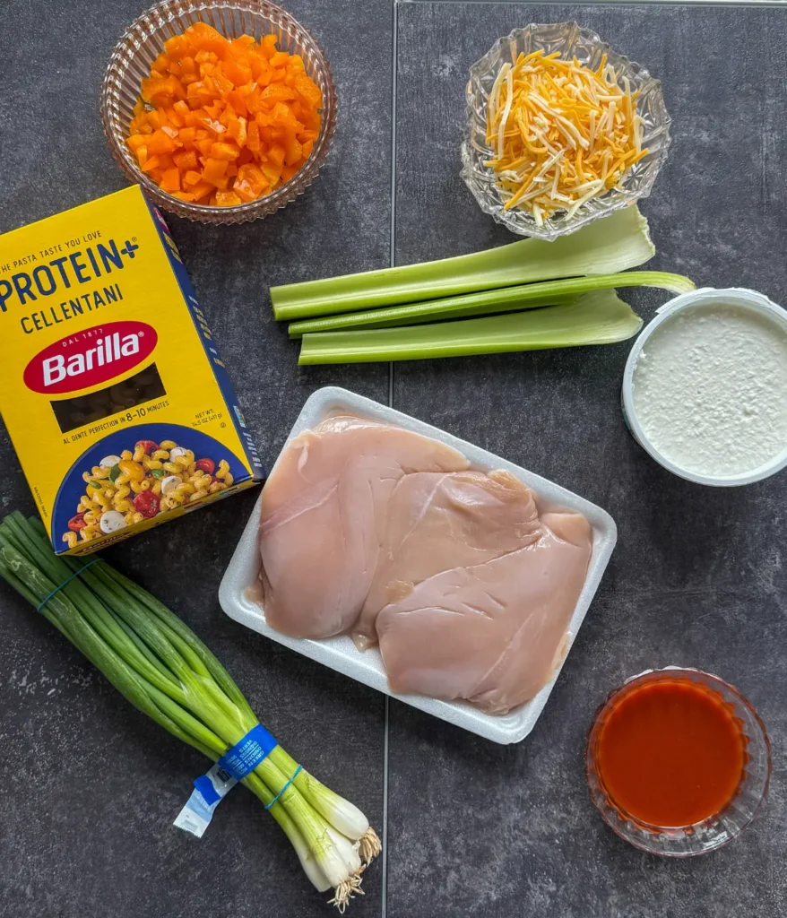 Individually portioned ingredients for the buffalo chicken slow cooker pasta with cottage cheese.