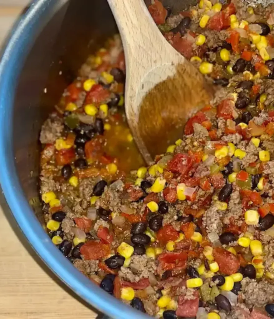 Pot of Mexican Chili After Canned Tomatoes, Black Beans and Corn Added.