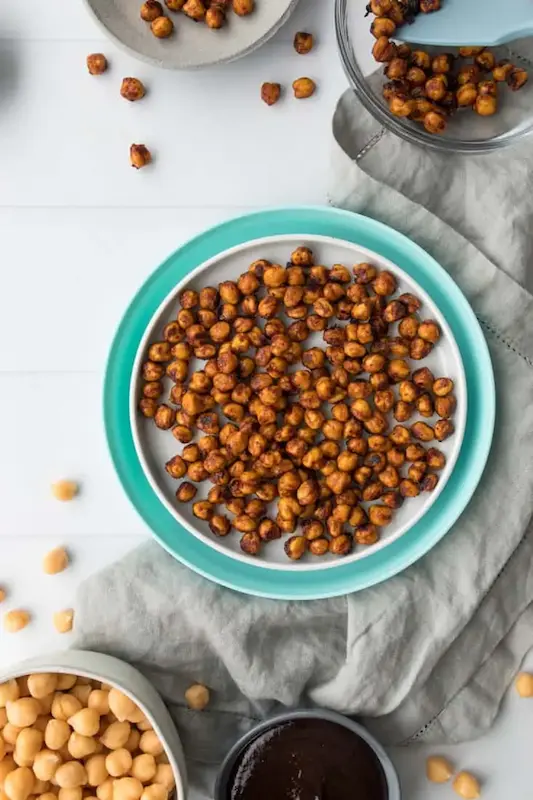 A plate of roasted chickpeas for a healthy, high protein breastfeeding snack.