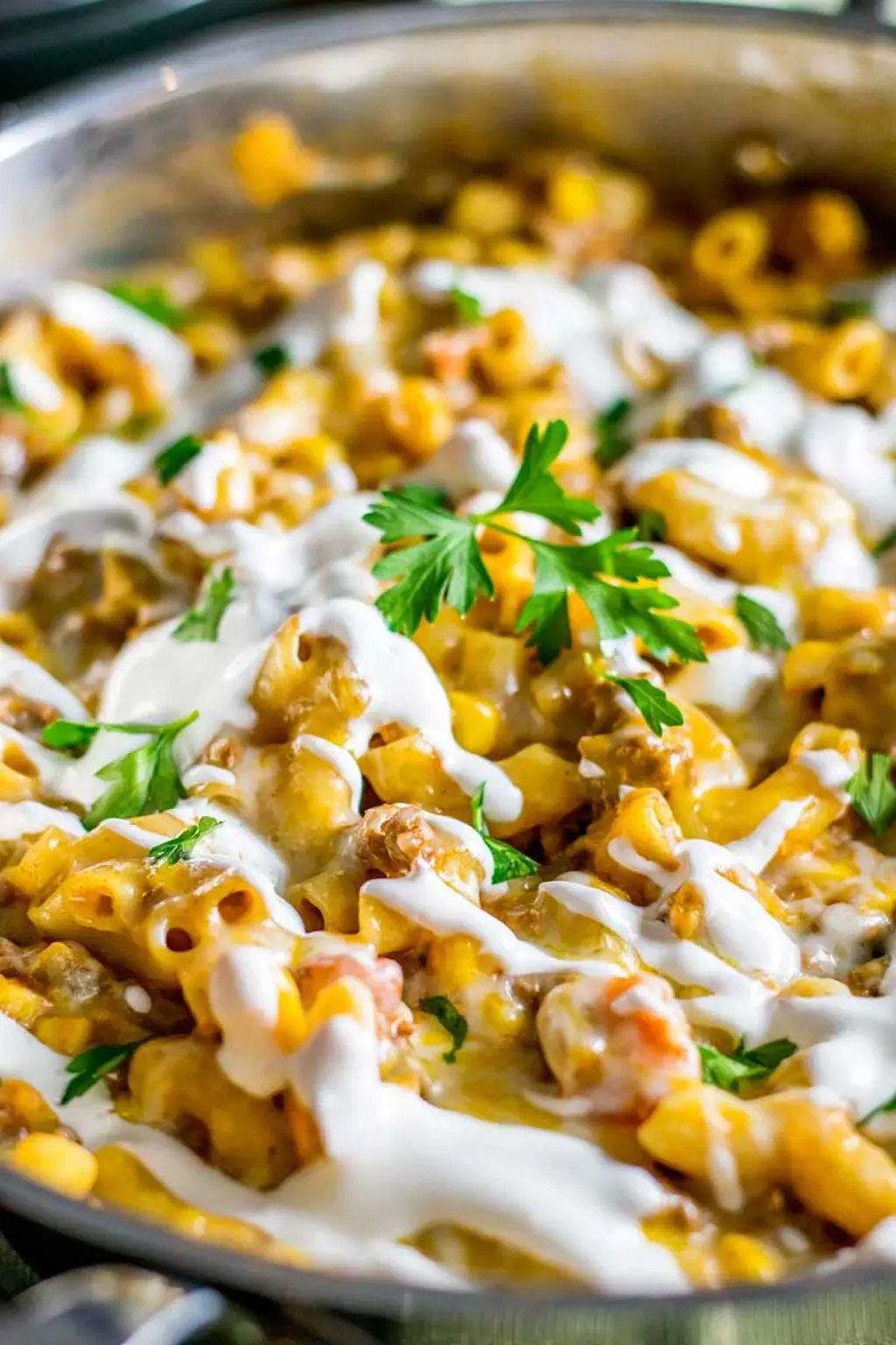 A cheesy taco skillet on a table.