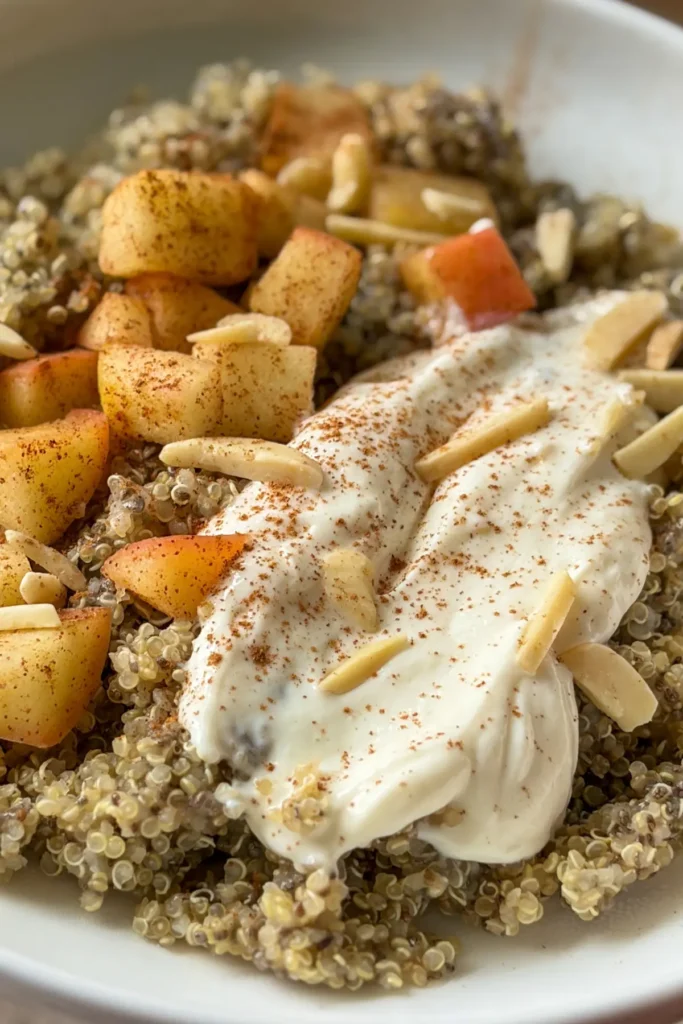 A close-up of a fully assembled quinoa apple cinnamon bowl.