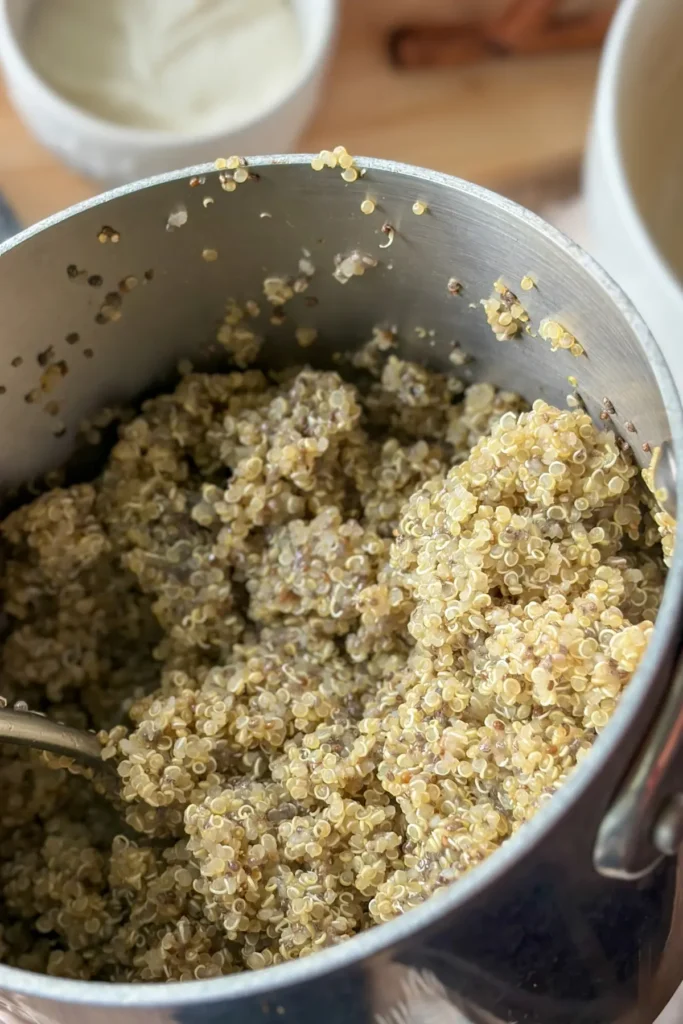 A close-up of a pot of quinoa with chia seeds in it after cooking.