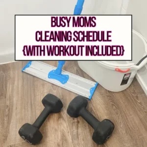 A set of dumbbells next to a mop on the floor in the bathroom for busy moms cleaning schedule main header image.