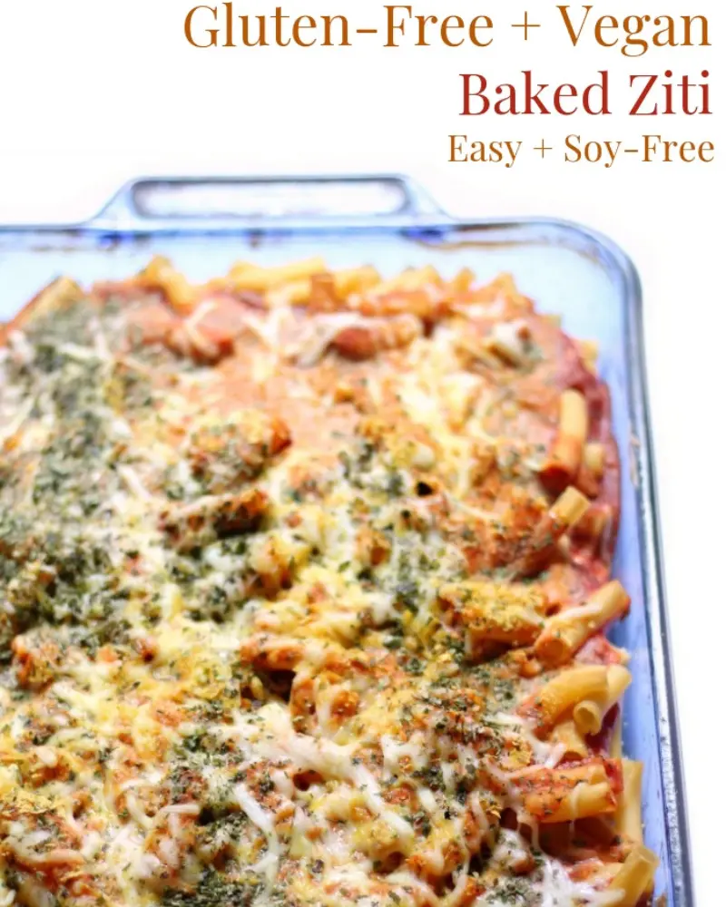 Baked ziti in a glass pan after baking.
