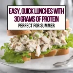 A chicken salad sandwich on a white plate for 30 grams of protein lunches main header image.