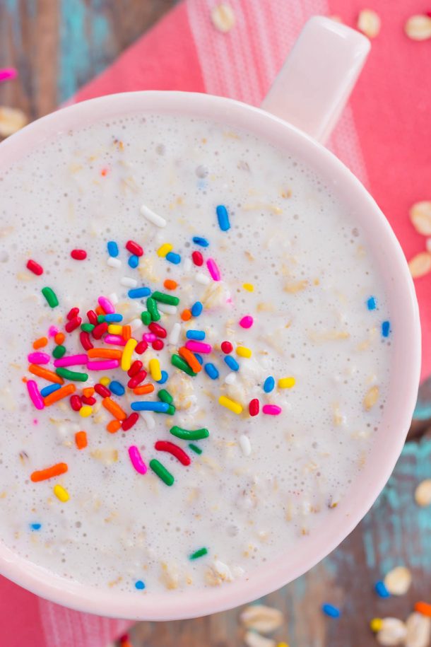 Cake batter overnight oats in a large white bowl with sprinkles on top.