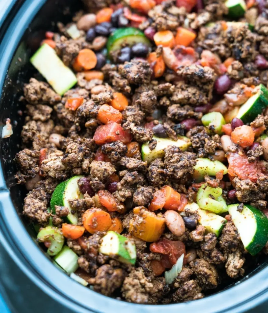 Spicy turkey chili with zucchini in a crockpot.