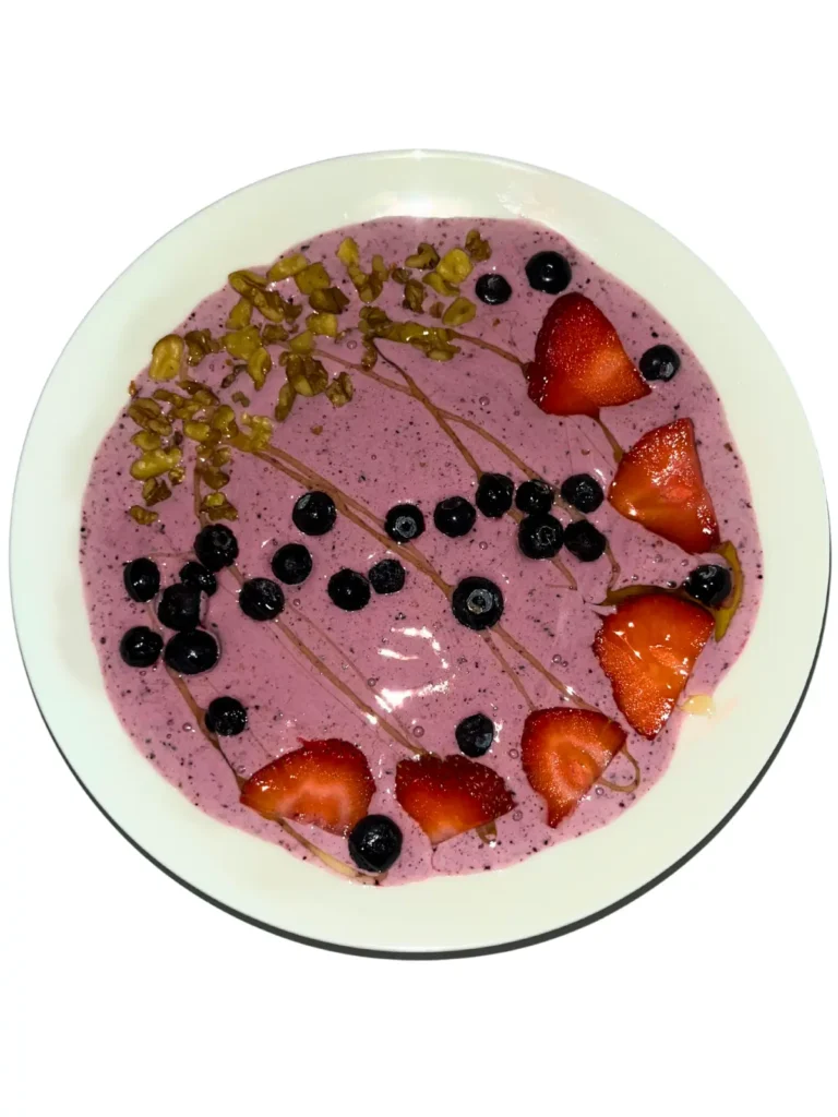 A fully assemble lemon berry smoothie bowl with kefir.