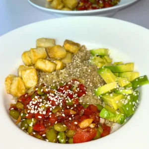 A high protein tofu and edamame bowl on a counter.