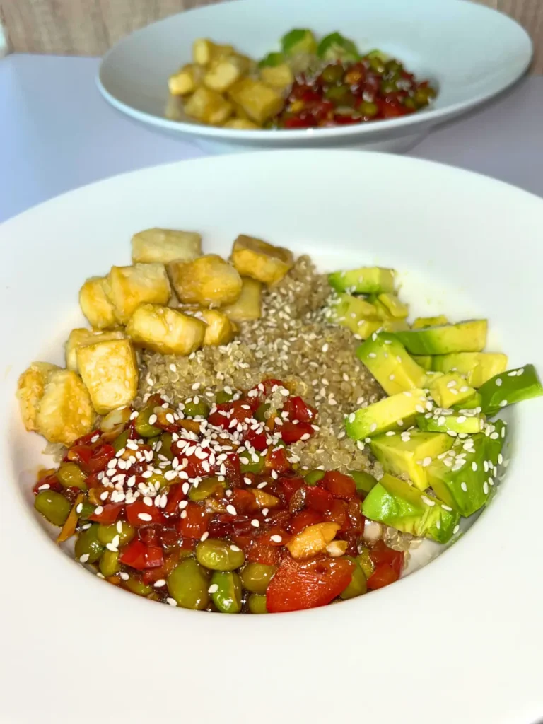 A high protein tofu and edamame bowl on a counter.