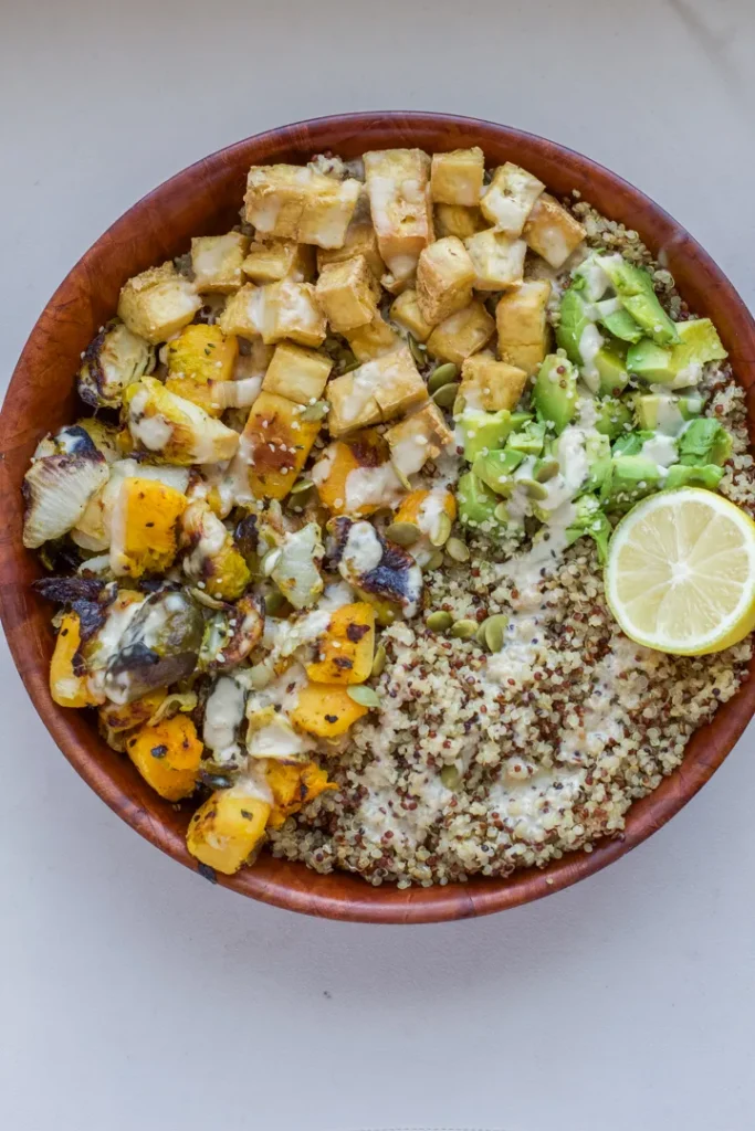 A plant-based, dairy-free, gluten-free buddha bowl on a table.