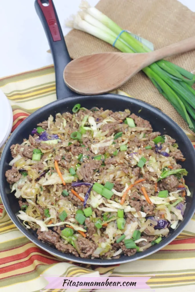 Inside out egg roll dish in a pan after baking on a towel on a table.