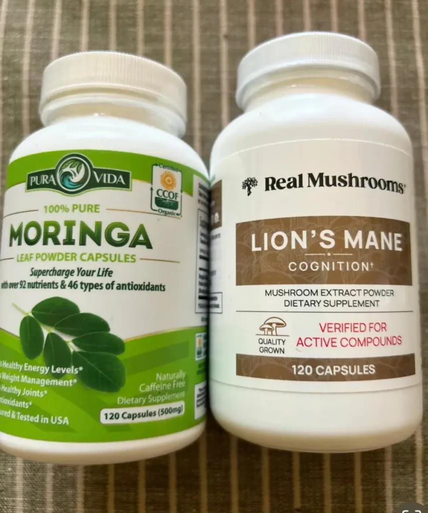 Two bottles of medicinal mushroom supplements: moringa and lion's mane.