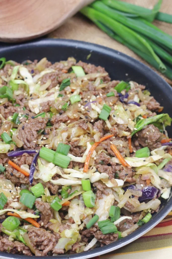A large pan with inside out egg roll cooked on a table.