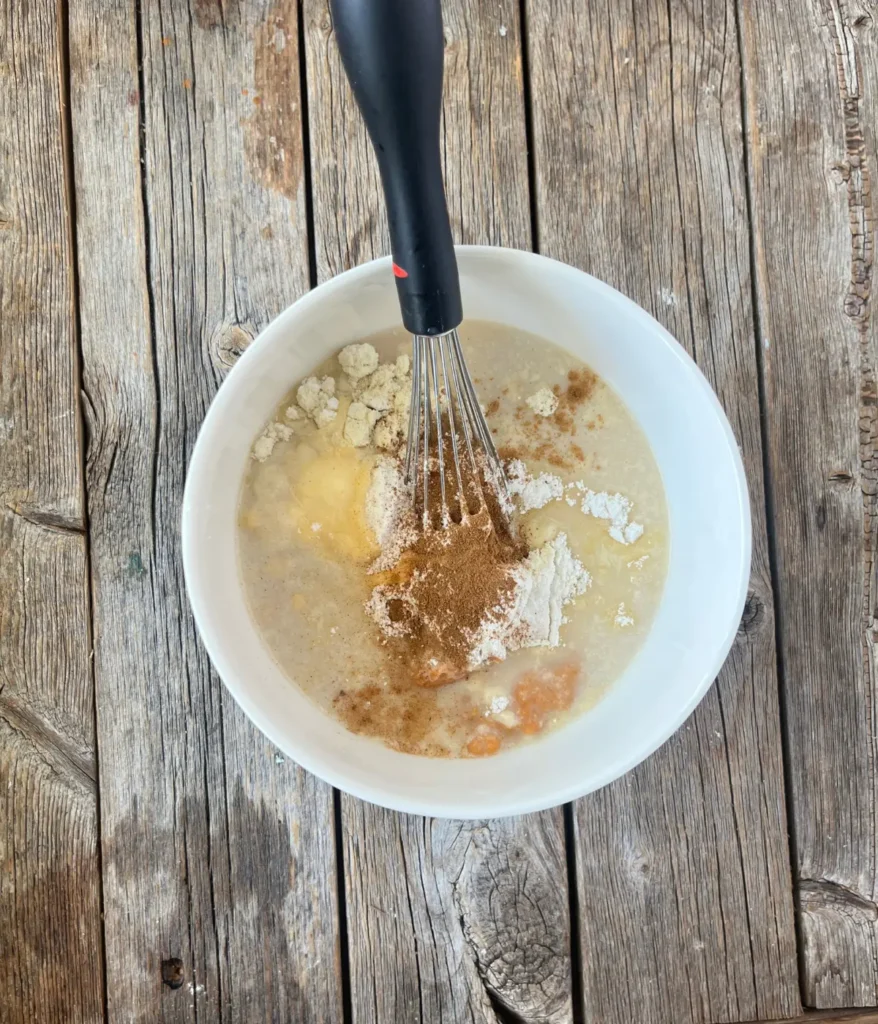 Whisking the ingredients in in a bowl.