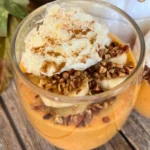 A close-up of the toppings on top of the pumpkin cheesecake pudding.