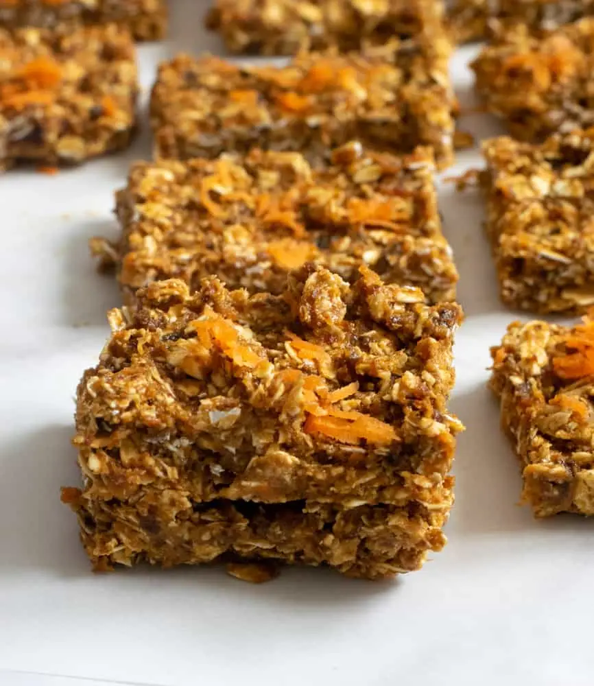 Sliced carrot cake bars on a counter.