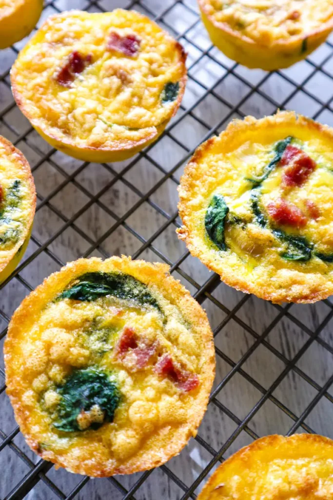 Mini egg bites cooling on a cooling rack.