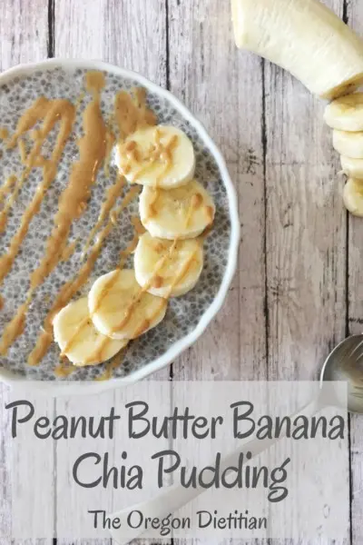 Chia pudding topped with a drizzle of peanut butter and banana slices on a table.