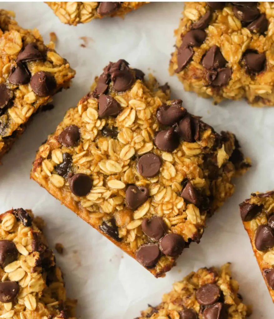 Sliced chocolate chip baked oatmeal bars on a counter.