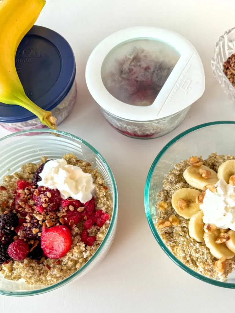 Meal prepping storage containers of the high protein quinoa breakfast bowl in airtight containers on a counter.