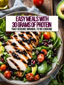 An easy, minimal cooking required grilled chicken salad with black beans and avocado in a bowl on a table.