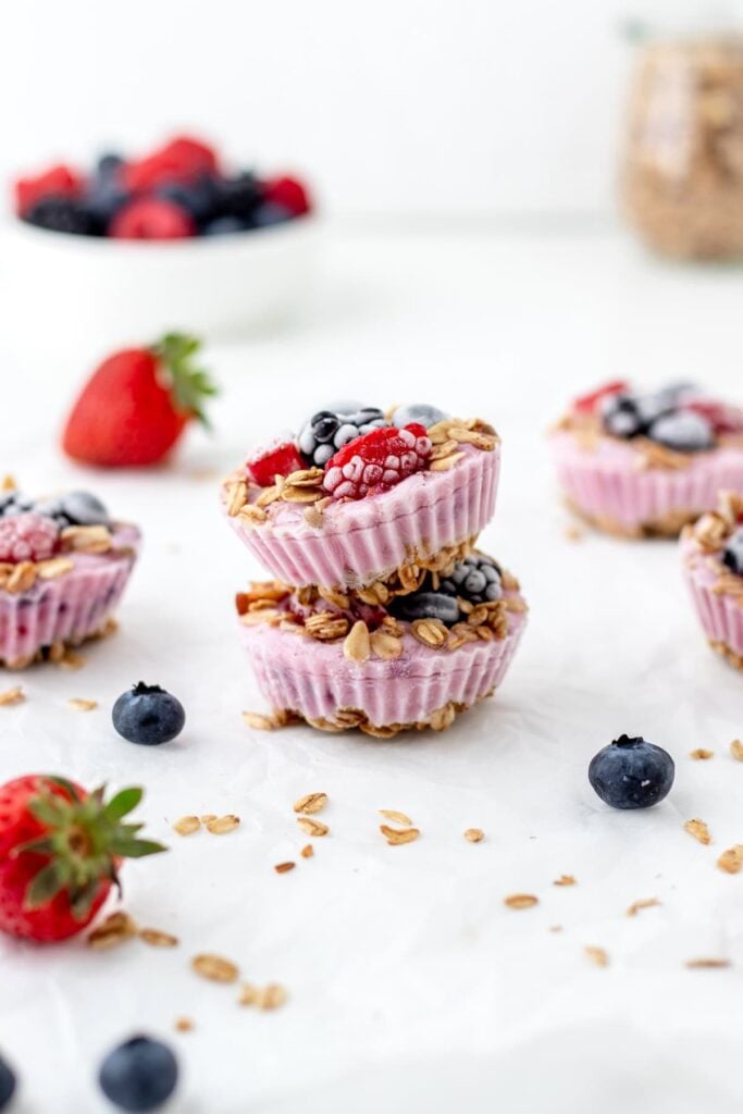 Two frozen Greek yogurt fruit bites stacked on top of one another on a counter.