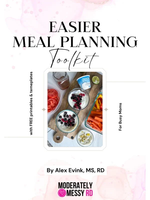 The title page for the Easier Meal Planning toolkit with a photo of different meal prepped components on a cutting board.