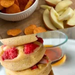 A collage of a photo showing sweet potato chips in a bowl along with apple slices and a stack of protein donuts on a plate.