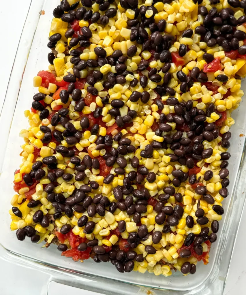 A fully assembled quinoa casserole prior to baking in the oven.
