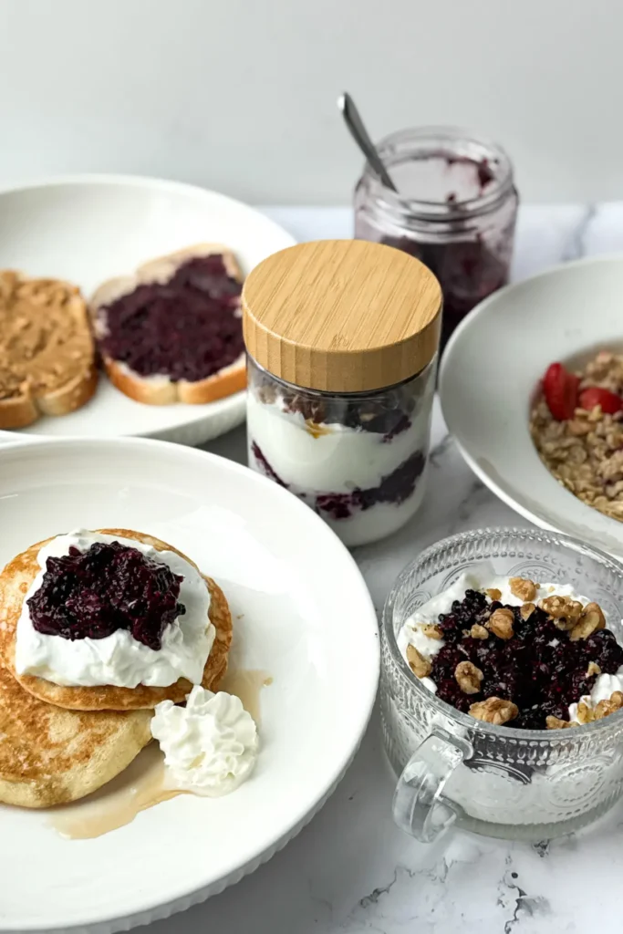 Different meals and snacks with chia seed jam on a table.