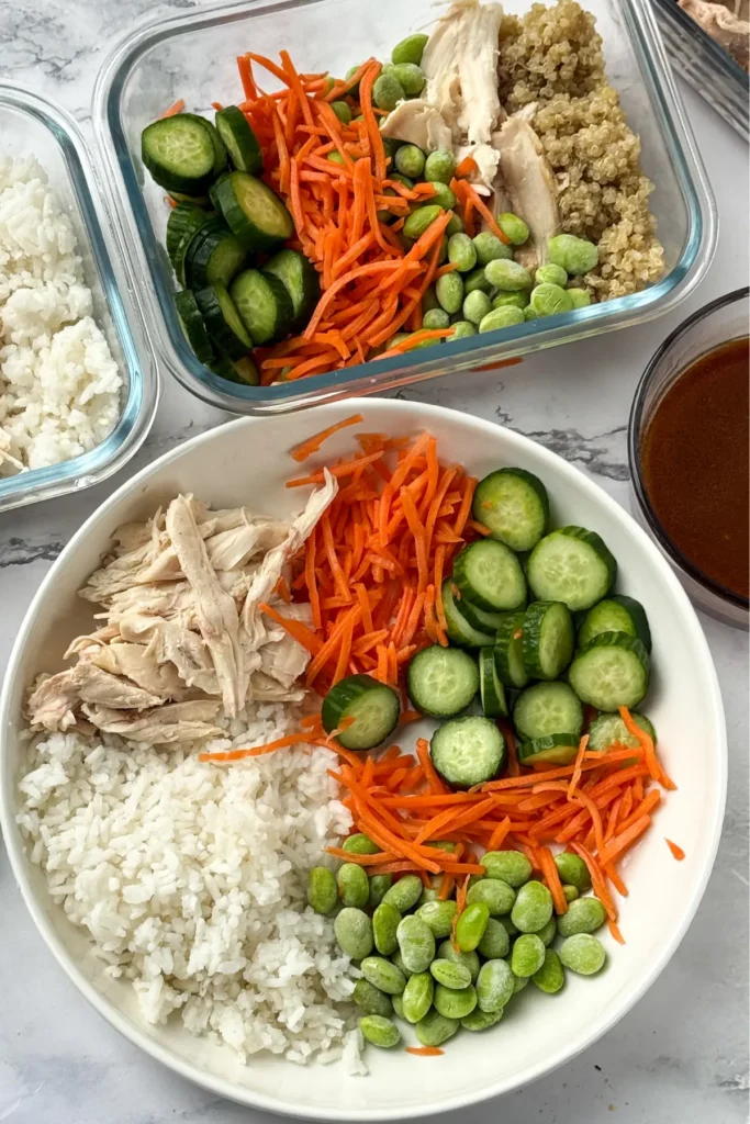 A fully assembled bowl without the sauce or drizzle of mayo on a counter.