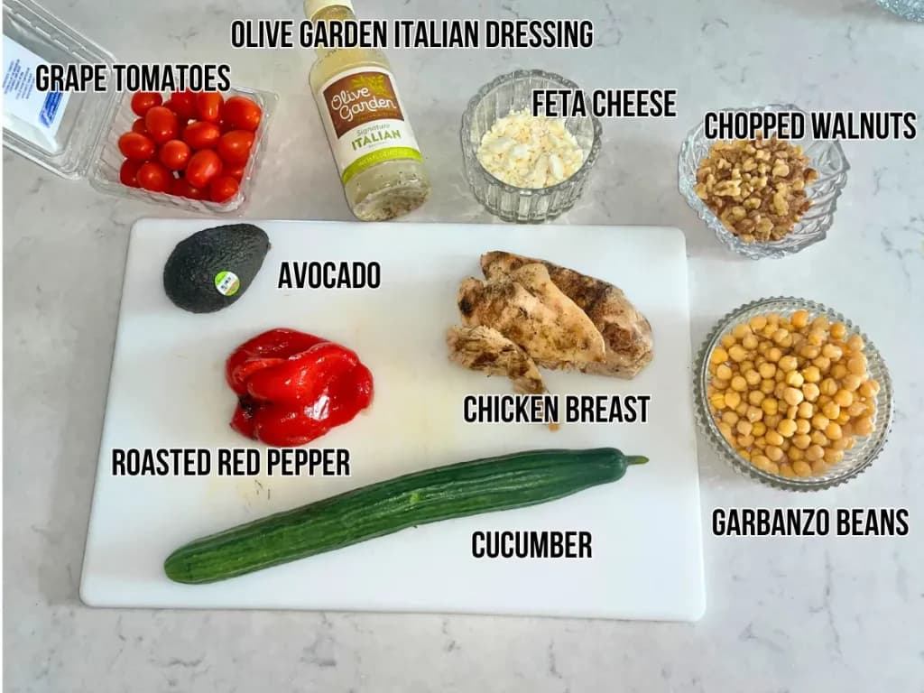 Ingredients for the easy chicken salad on a cutting board on a counter.