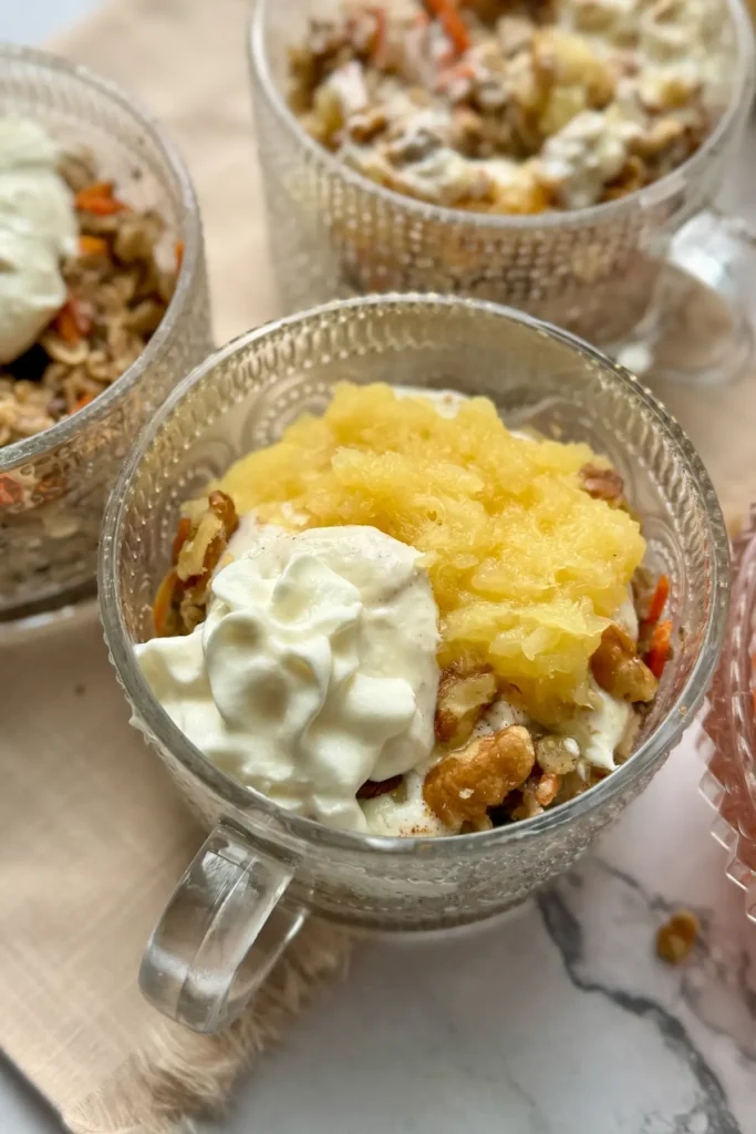 Fully assembled close-up of a loaded oatmeal bowl on a beige napkin on a table.