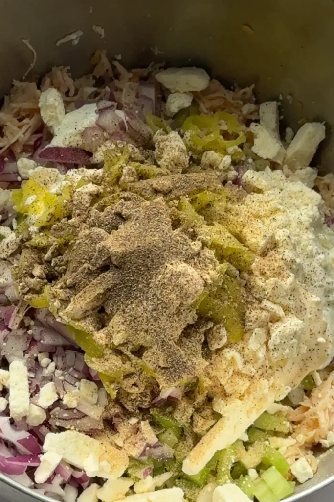 Every ingredient added into a mixing bowl before stirring.