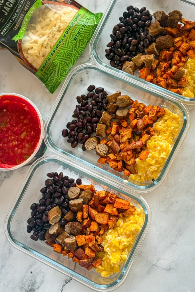 A breakfast bowl being assembled without the cheese.