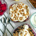 A birds-eye view of the two fruit cobblers fully assembled with toppings on a table.
