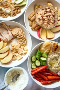 Four fully assembled fall dinner plates on a counter.