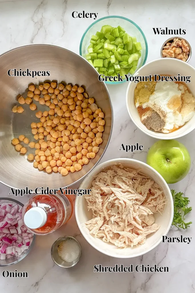 Ingredients portioned out for the honey mustard chickpea chicken salad on a counter.