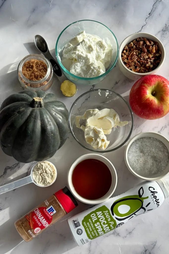 The ingredinets portioned out for the acorn squash boats on a counter.