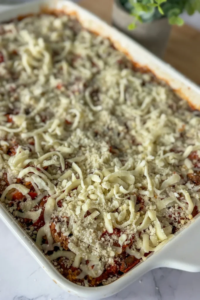 Adding shredded cheese and parmesan after baking