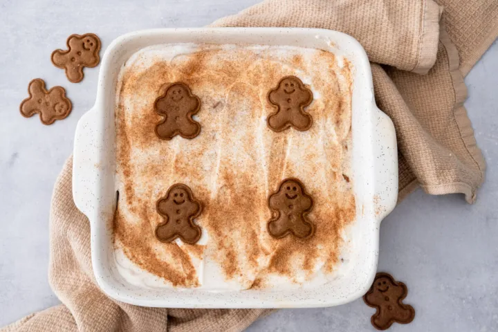 A gingerbread bake oatmeal topped with yogurt on a counter.