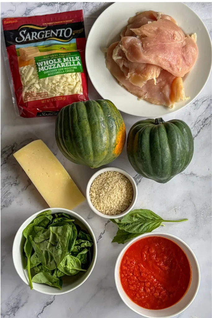 Ingredients on a counter for the chicken parmesan stuffed acorn squash.