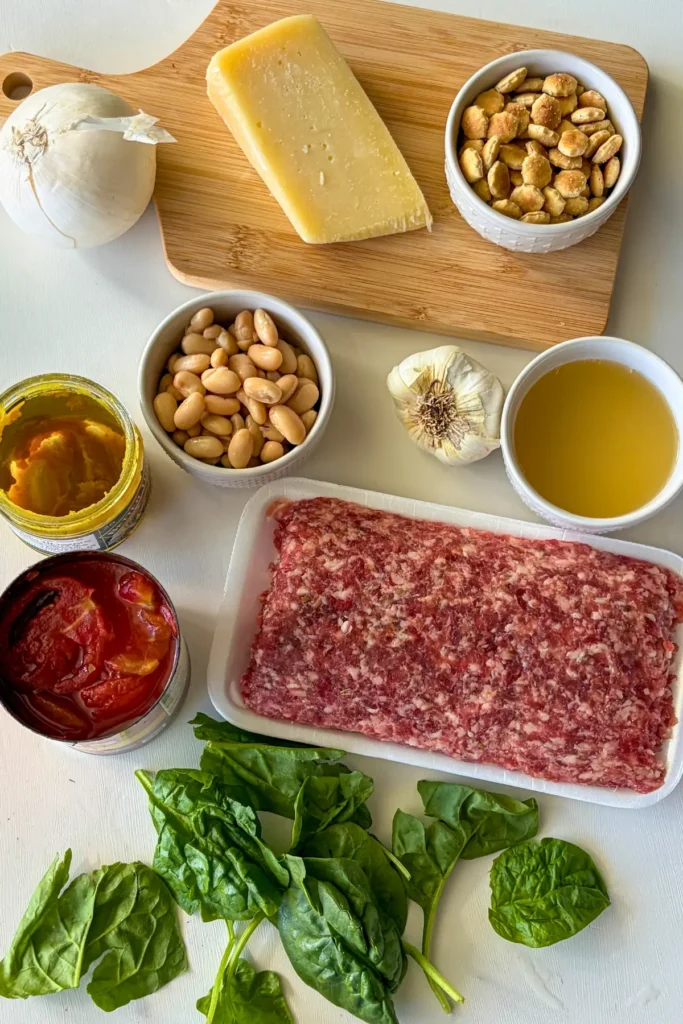 Ingredients for the Italian sausage tortellini soup on a counter.